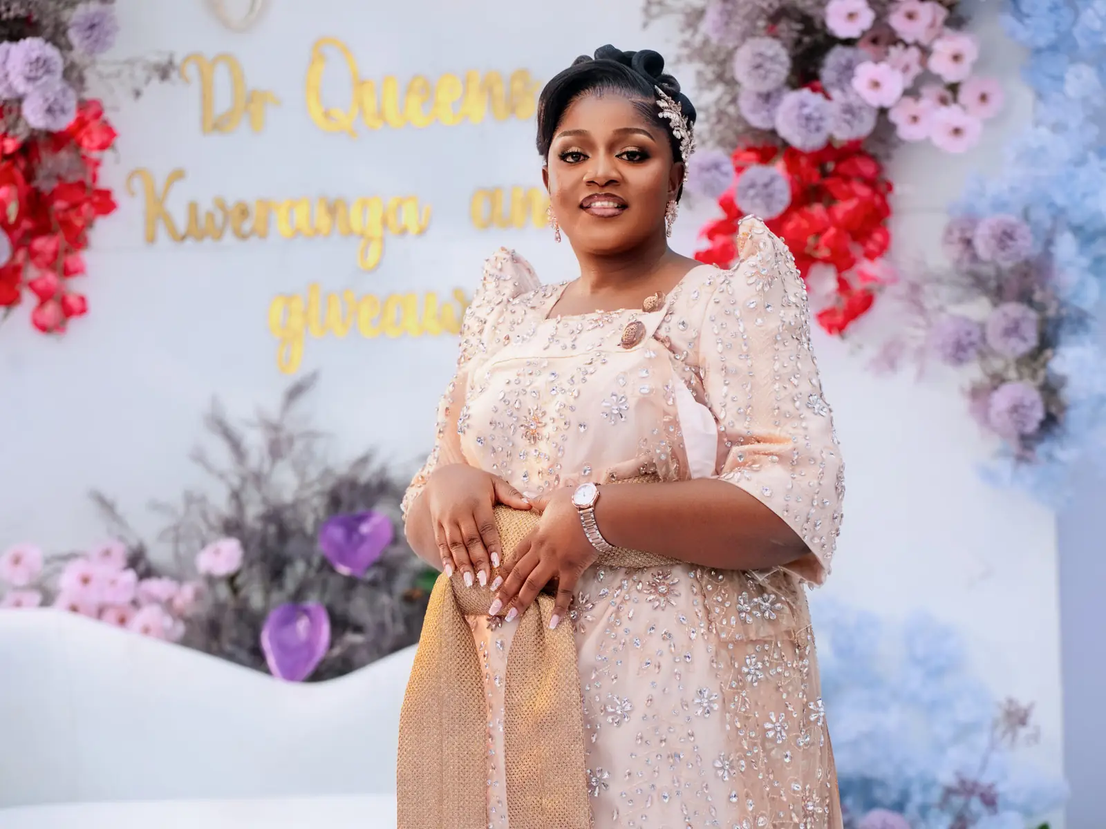 A bride in a gomesi at her introduction ceremony