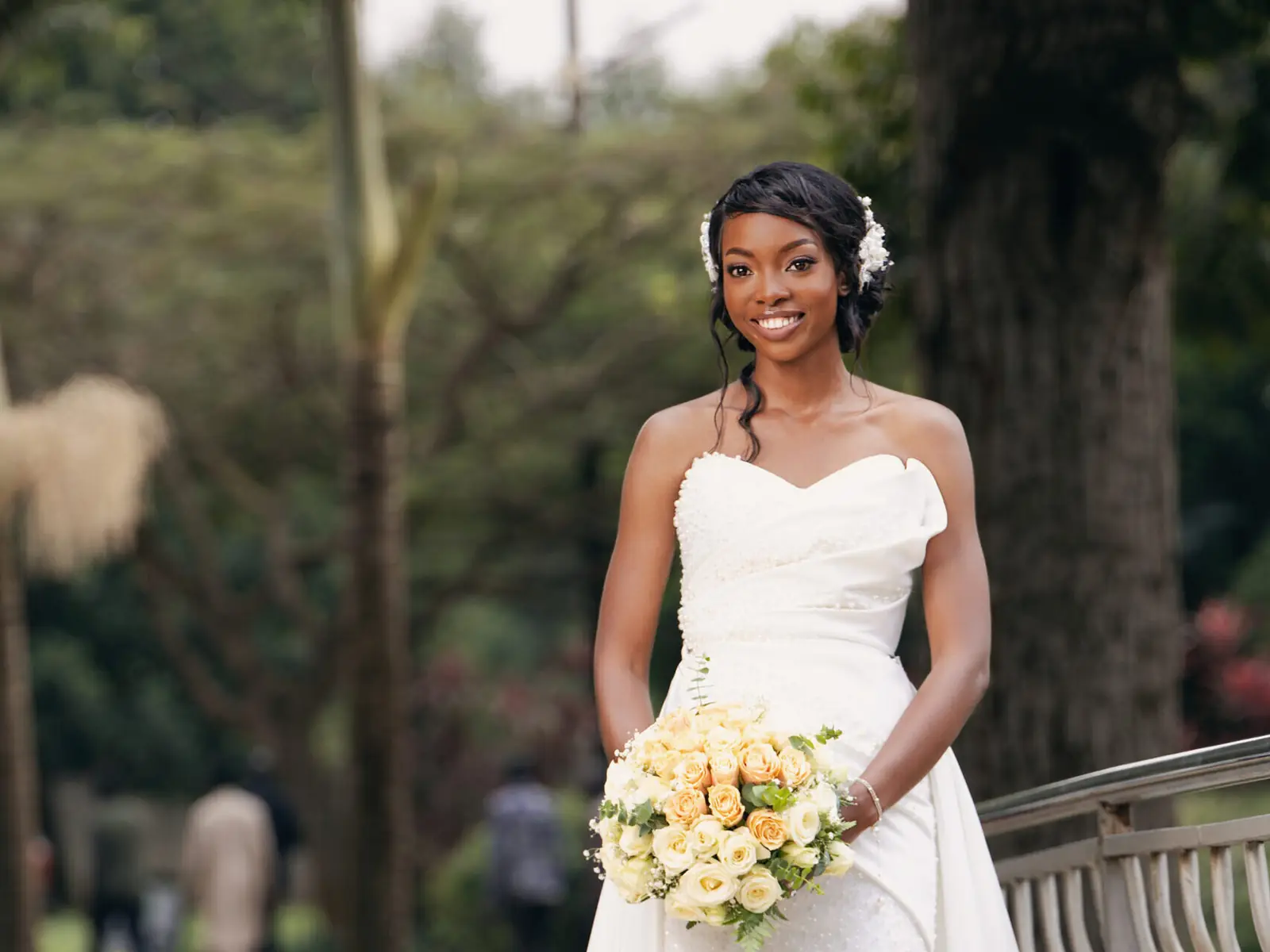 A bride holding her bouquet in a garden